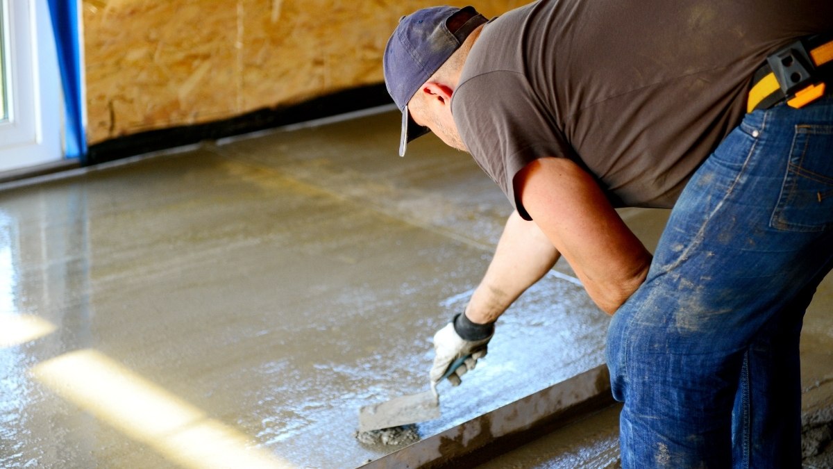 smoothing a freshly poured, wet concrete floor